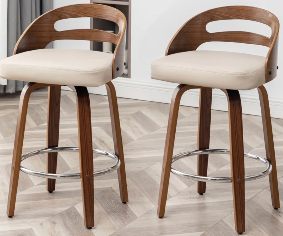 wood and beige swivel barstools
