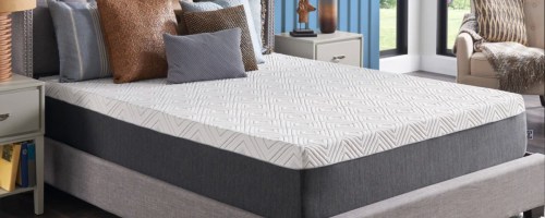 white sealy mattress on grey bed frame