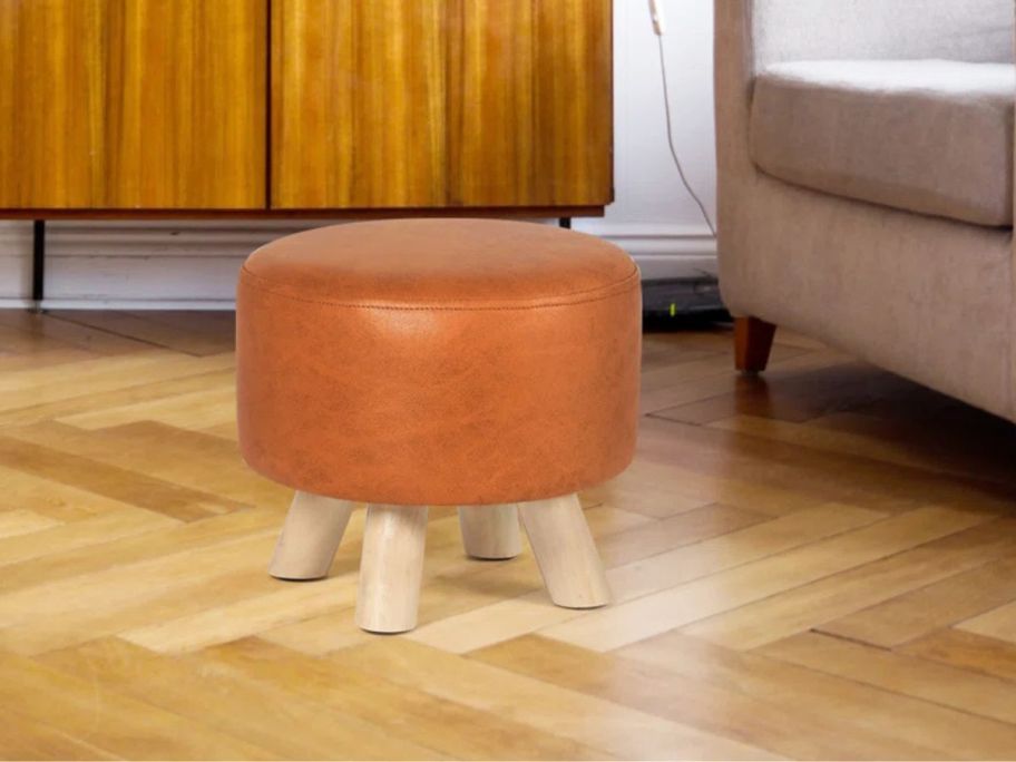orange Ottoman Foot Rest Stool in living room