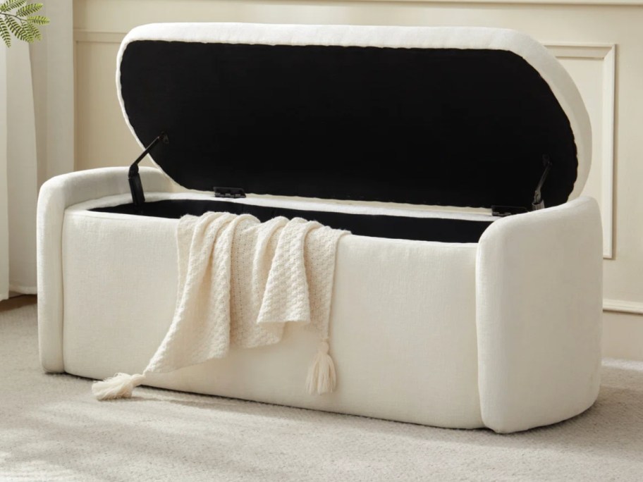 white boucle storage ottoman opened