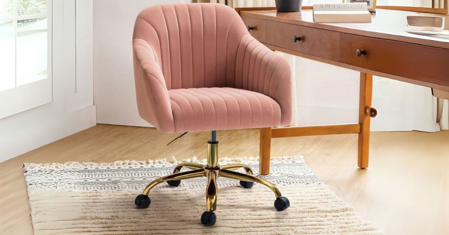 pink and hold office chair in office in front of desk