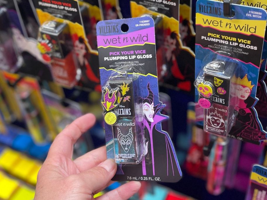 Wet N Wild Disney Villains Pick Your Vice Plumping Lip Gloss in hand in store