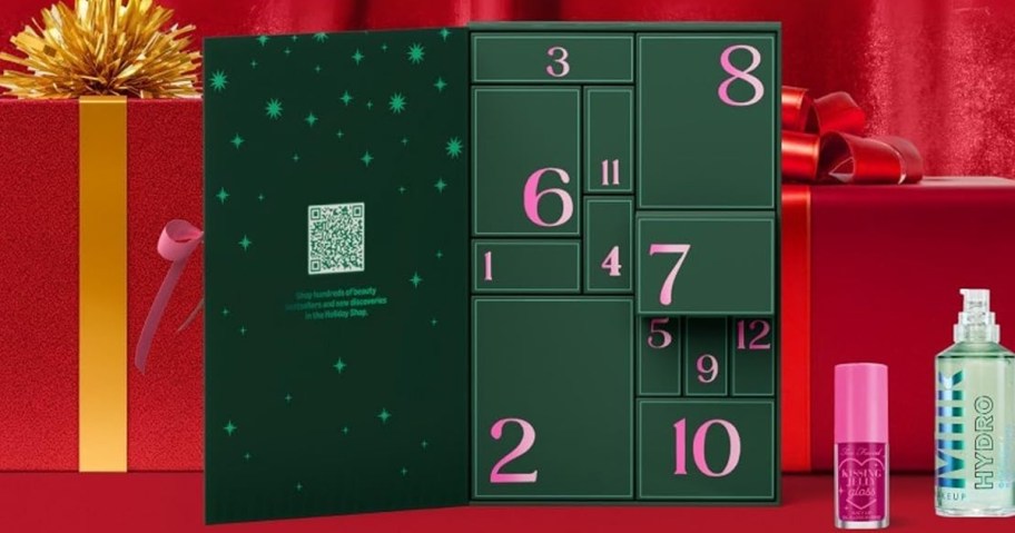 green advent calendar next to too faced lip gloss and milk primer