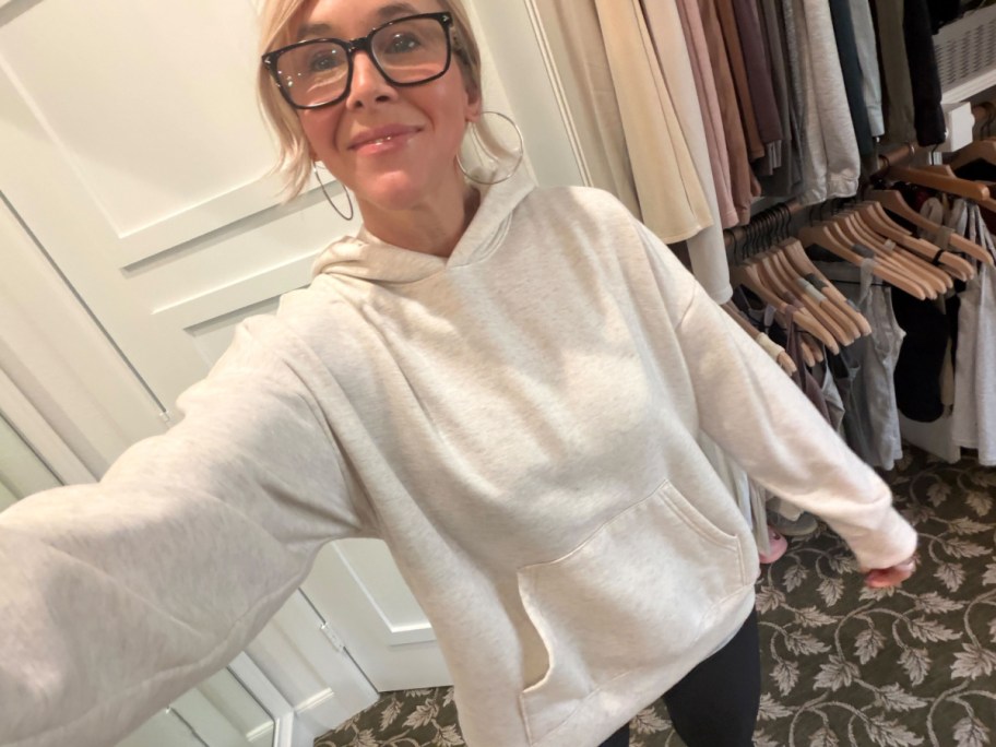 Woman wearing a white hoodie