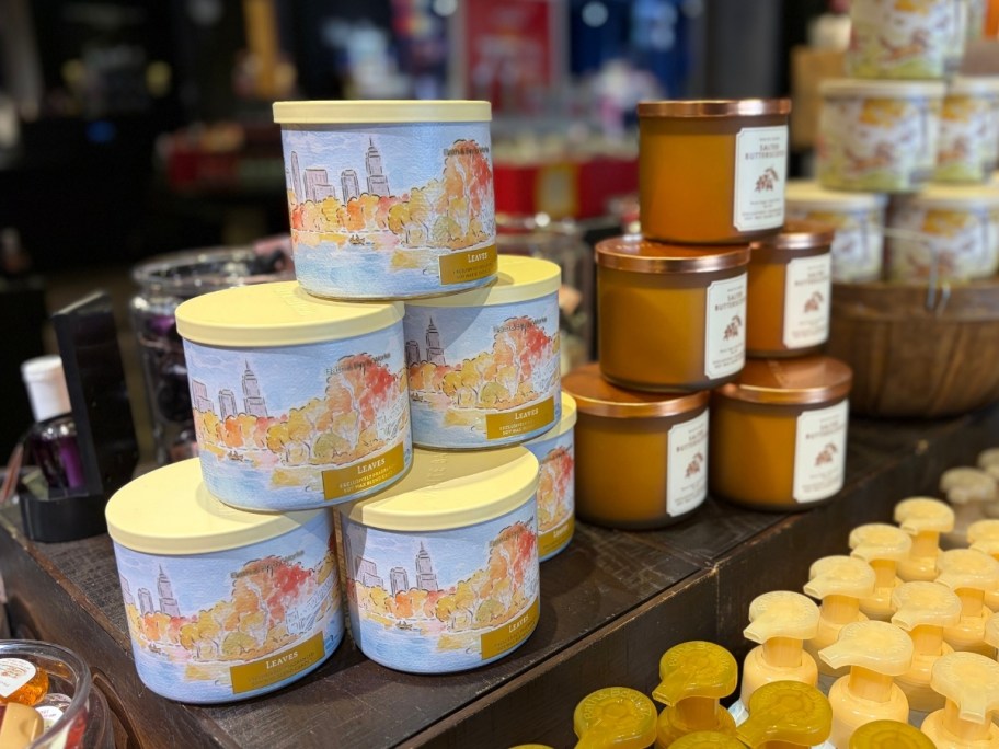 3 wick candles on display in stacks