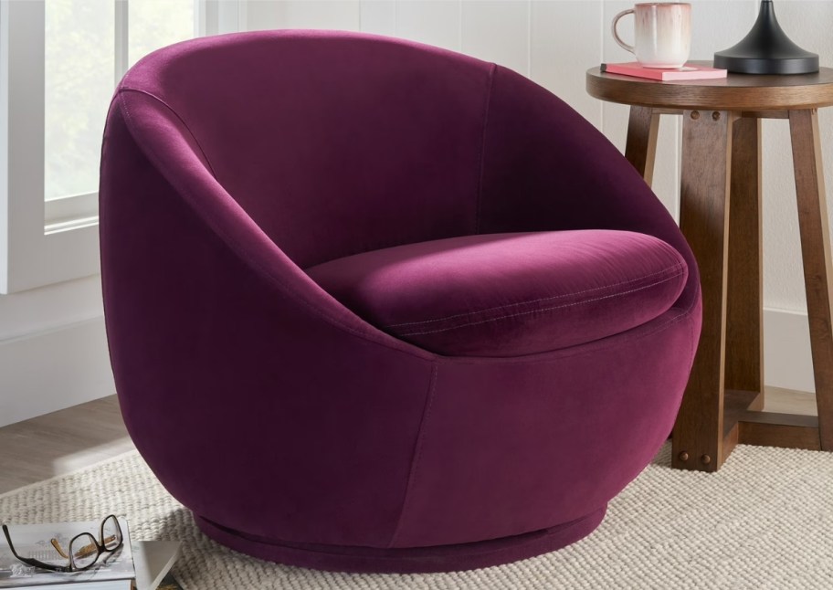 wine colored velvet swivel chair