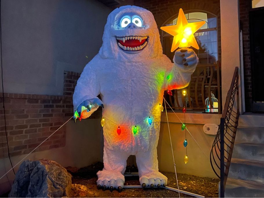 Bumble snowman displayed outside in the dark 