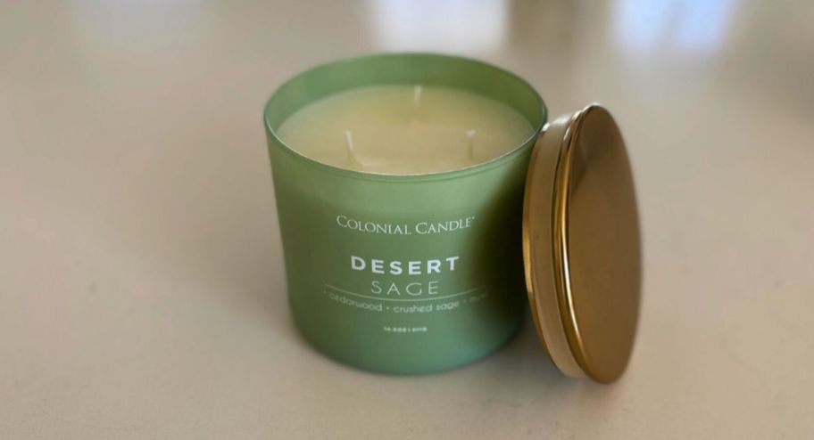 Colonial Candle Desert Sage 14.5oz Jar displaye don top of the table