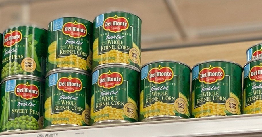cans of Del Monte Corn on a store shelf
