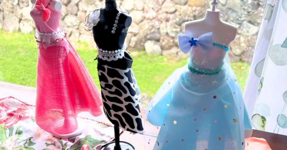 3 Mannequins with dresses on them for fashion dolls