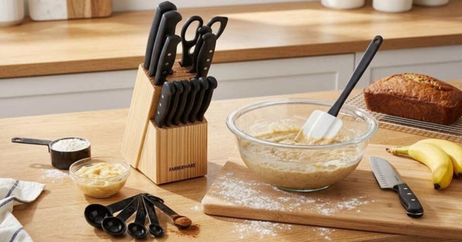 knife set in wood block on counter near other cooking tools