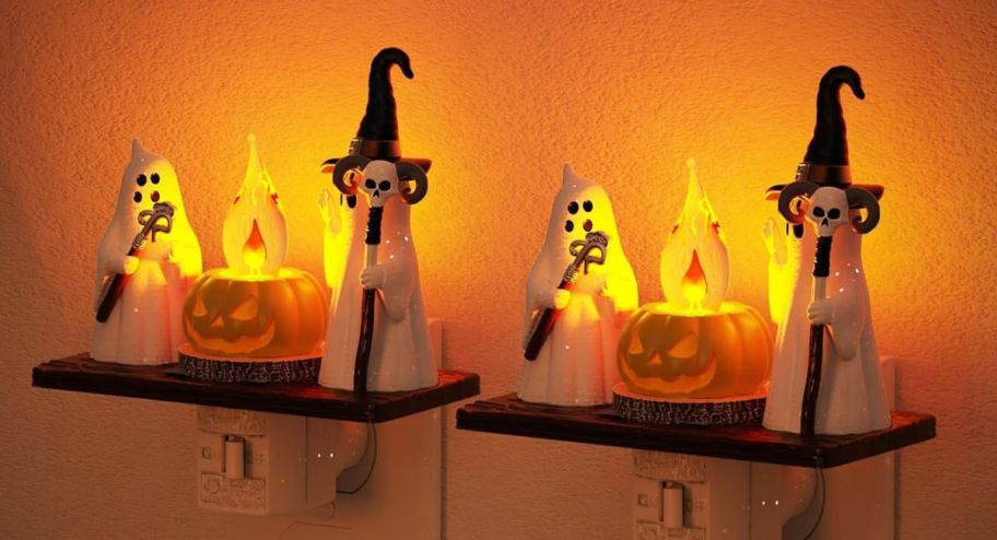 two Ghosts with canes on display