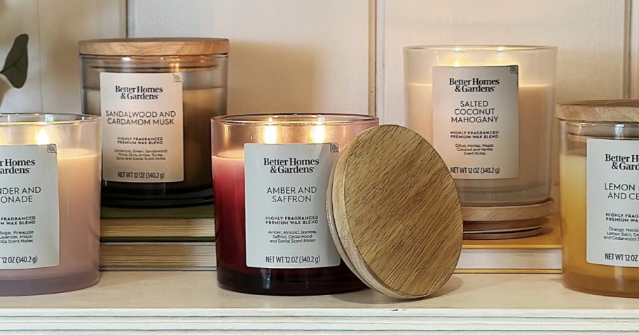 Better Homes and Gardens 2-Wick Ombre Candles lit on a shelf