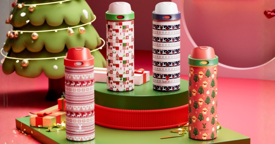 four water bottles with a Christmas design on them