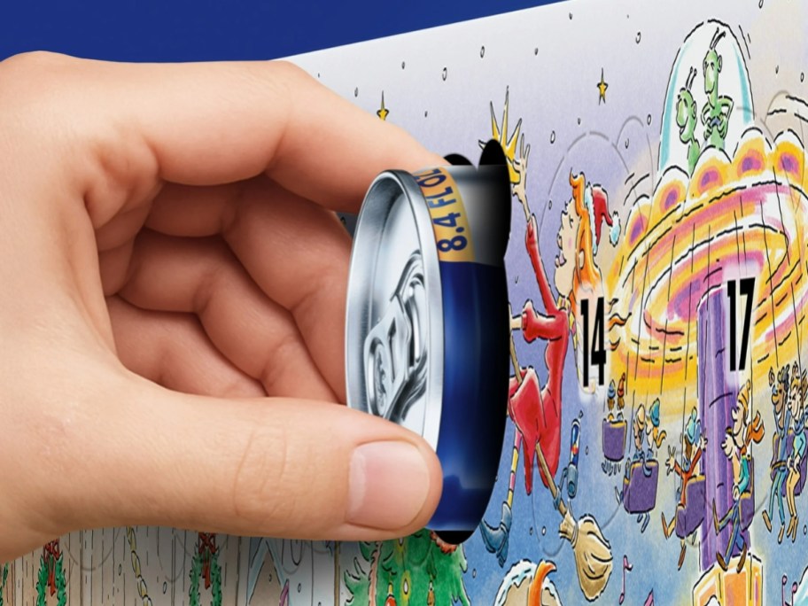 hand pulling a Red Bull can out of an advent calendar