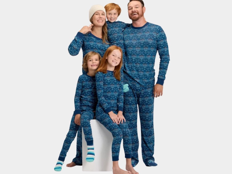 familiy wearing matching Hanukkah pajamas