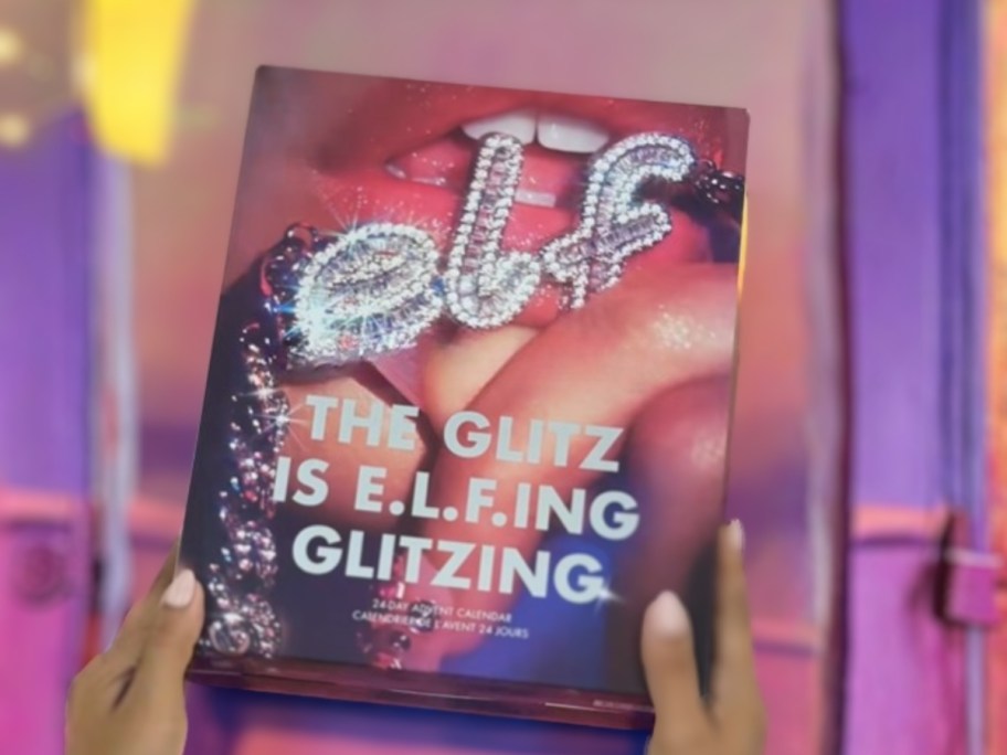 hands holding an e.l.f. Cosmetics advent calendar