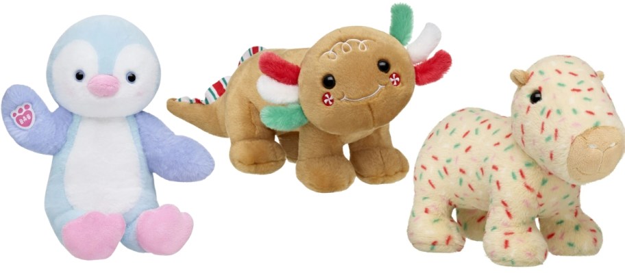 a plush penguin,, a plush gingerbread axolotl, and a plush capybara 