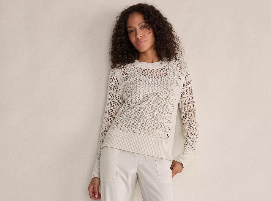 woman modeling cutout beige long sleeve shirt