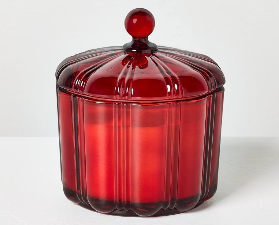 red jar candle on white background