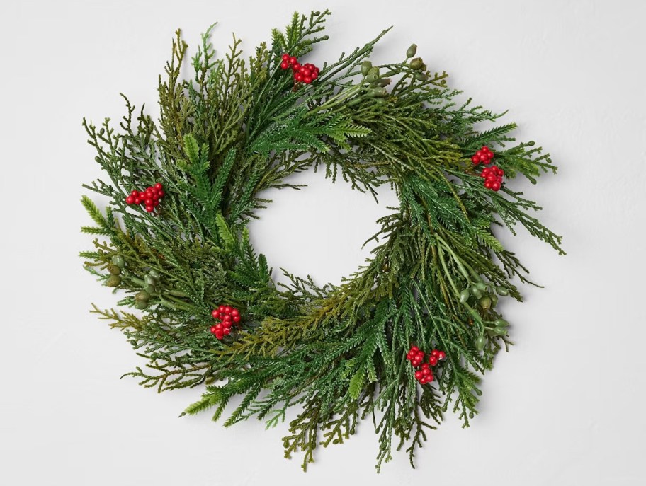 green and red berry wreath stock photo