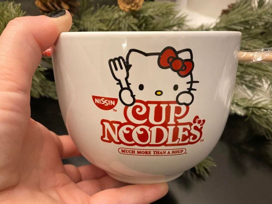 A person holding a Hello Kitty Ceramic Ramen Bowl