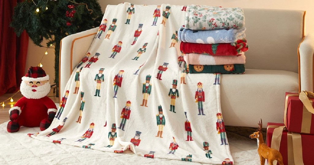 Different holidays themed blankets on white couch