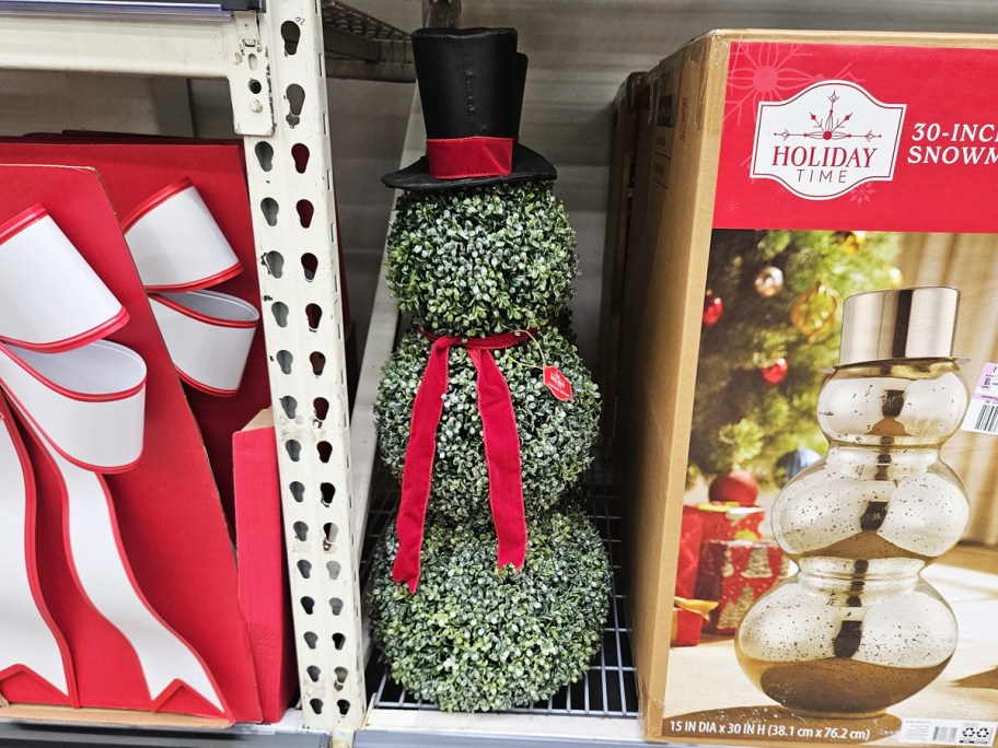 snowman shaped topiary on store shelf