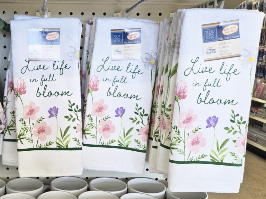 floral print kitchen towels hanging on store