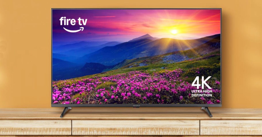 Insignia Fire TV on a wood tv stand