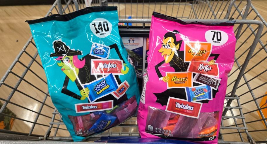 two candy bags inside of shopping cart 