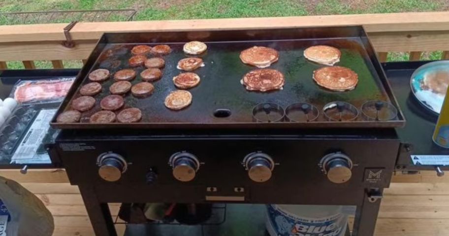 Member's Mark 4-Burner Propane Gas Griddle with breakfast food on it