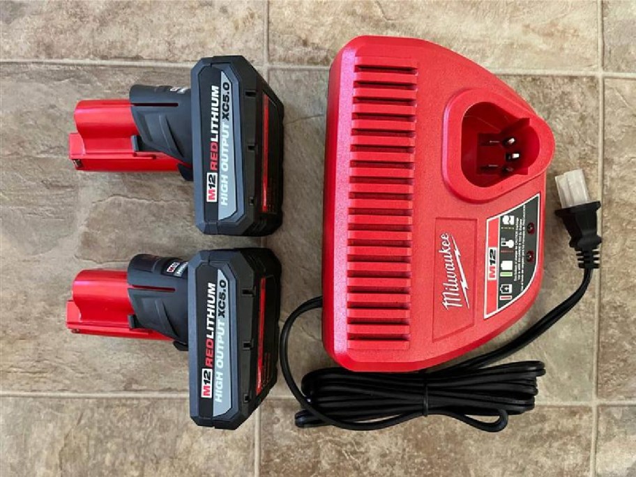 A Milwaukee 12-Volt Lithium-Ion High Output Battery Packw/ Charger Starter Kit.