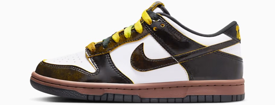 black and white nike sneaker with yellow laces