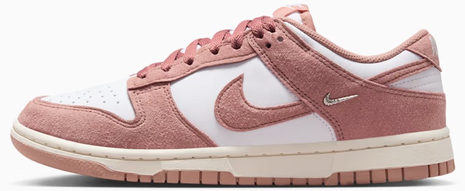 pink and white suede nike sneaker