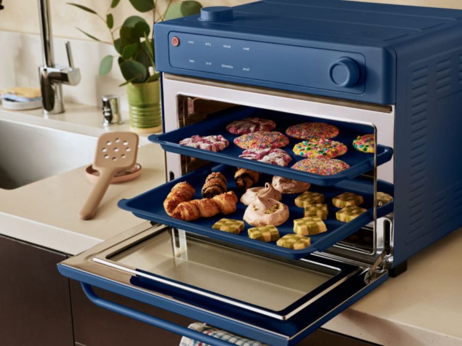 Our Place Wonder Oven Pro in blue with items inside