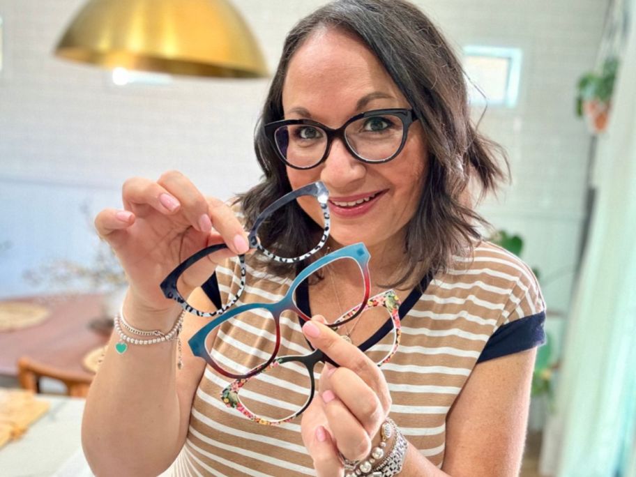 woman wearing Pair eyeglasses while holding 3 frame toppers