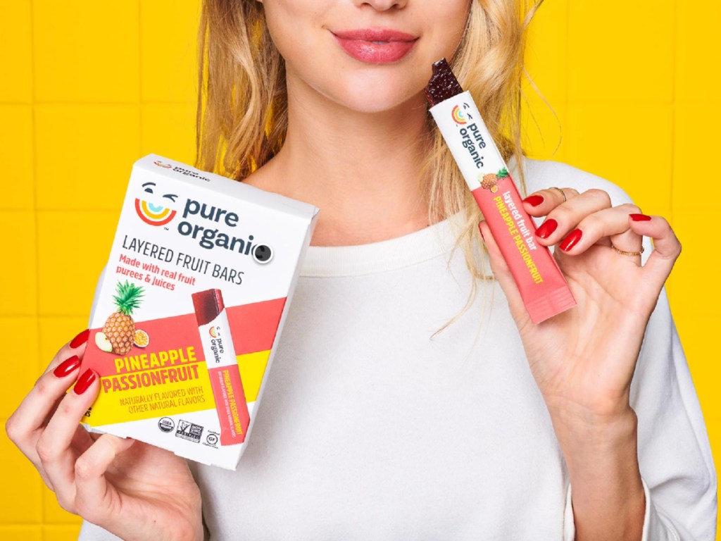 Woman, eating, pure, organic pineapple bars