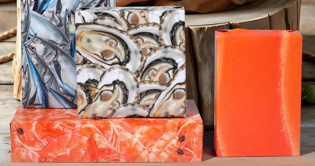 Boxes wrapped in different types of seafood and stacked on table top