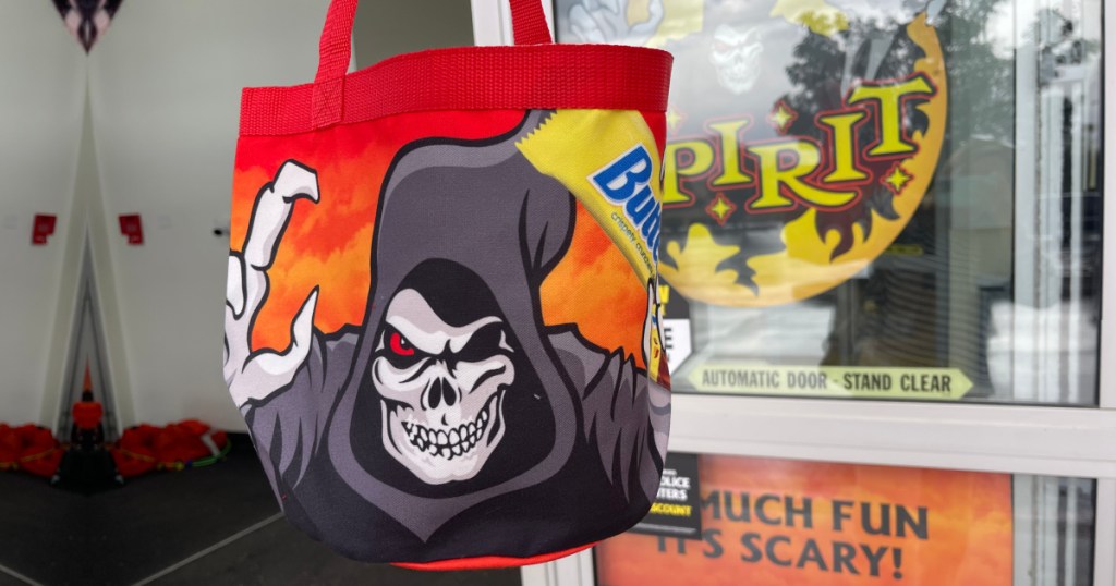 Halloween themed bag in front of spirit Halloween entrance