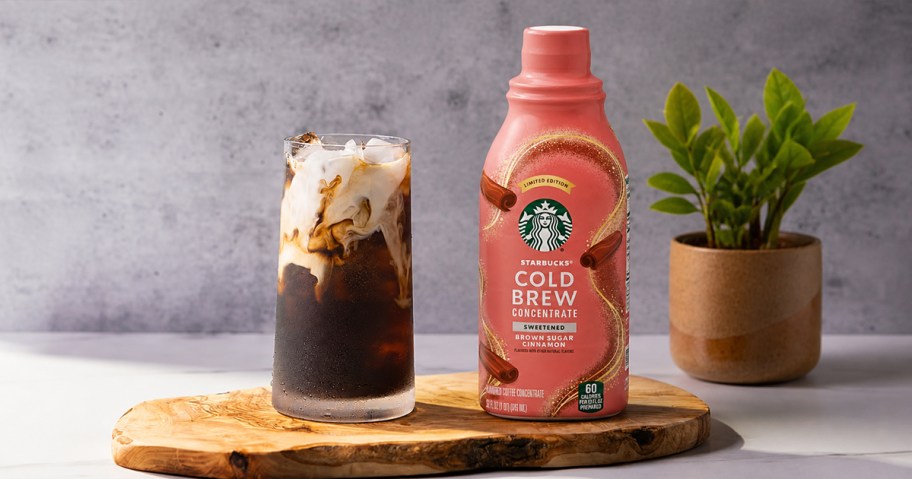 bottle of Starbucks Cold Brew Concentrate next to a glass of cold brew