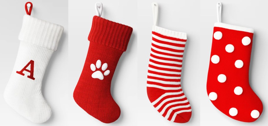 4 white and red knit stockings in a row