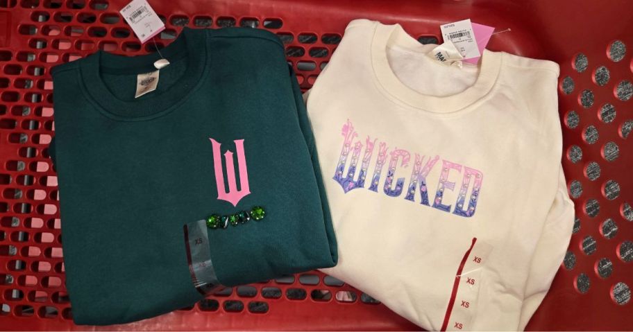 2 sweatshirts in a Target cart: one green, the other white
