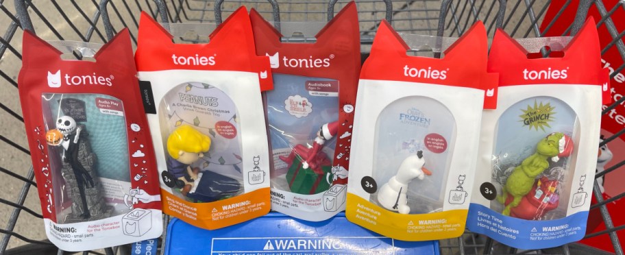 Four Tonies figurines in a cart.