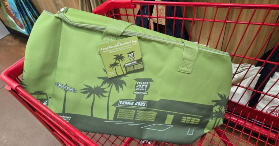 A green Trader Joe's insulated tote bag in a cart