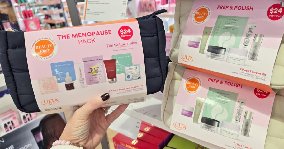 hand holding up ulta sample kit next to display of more sets