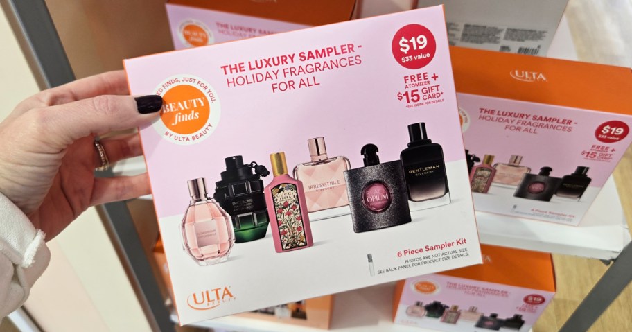 hand holding perfume sampler box in store