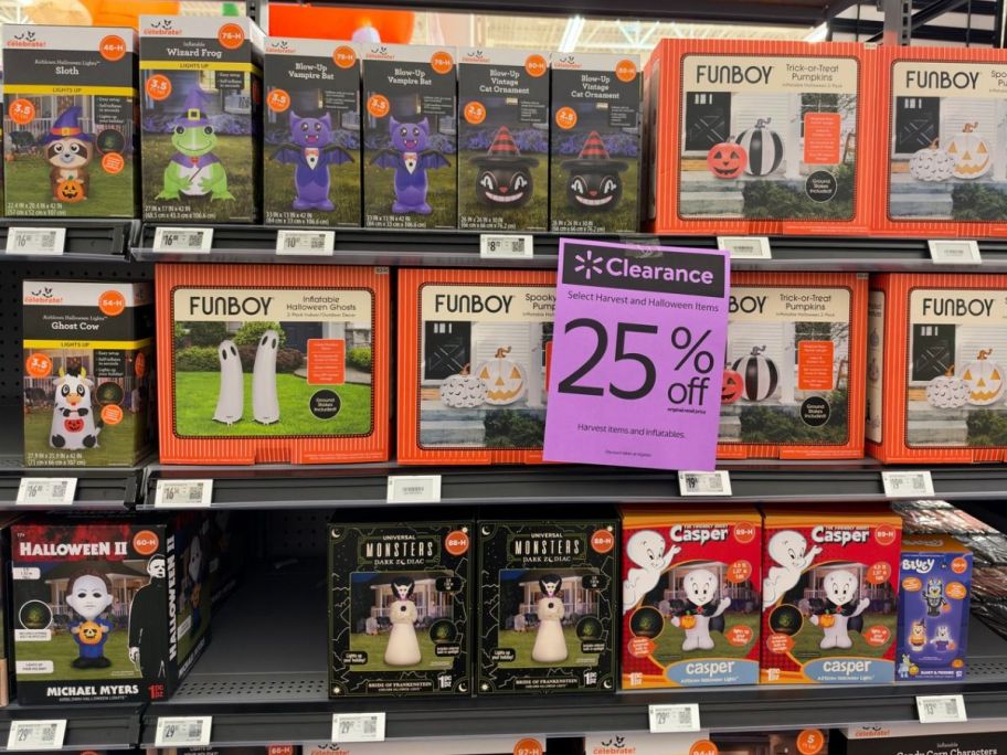 Inflatable Halloween Decor at Walmart with a 25% off clearance sign