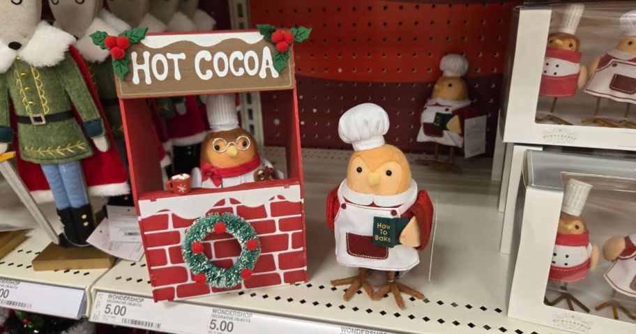 tiny decorative birds on a shelf 
