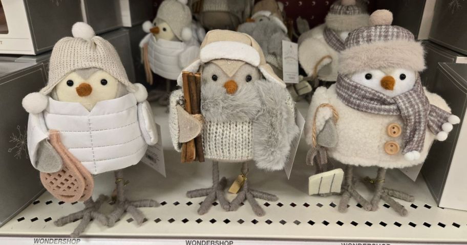 tiny decorative birds on a shelf 